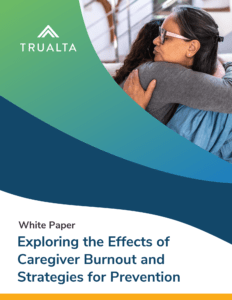 A woman embracing an elderly person with a document titled 