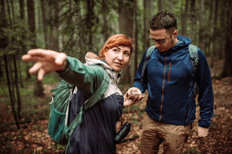 Orienteering with compass in old forest