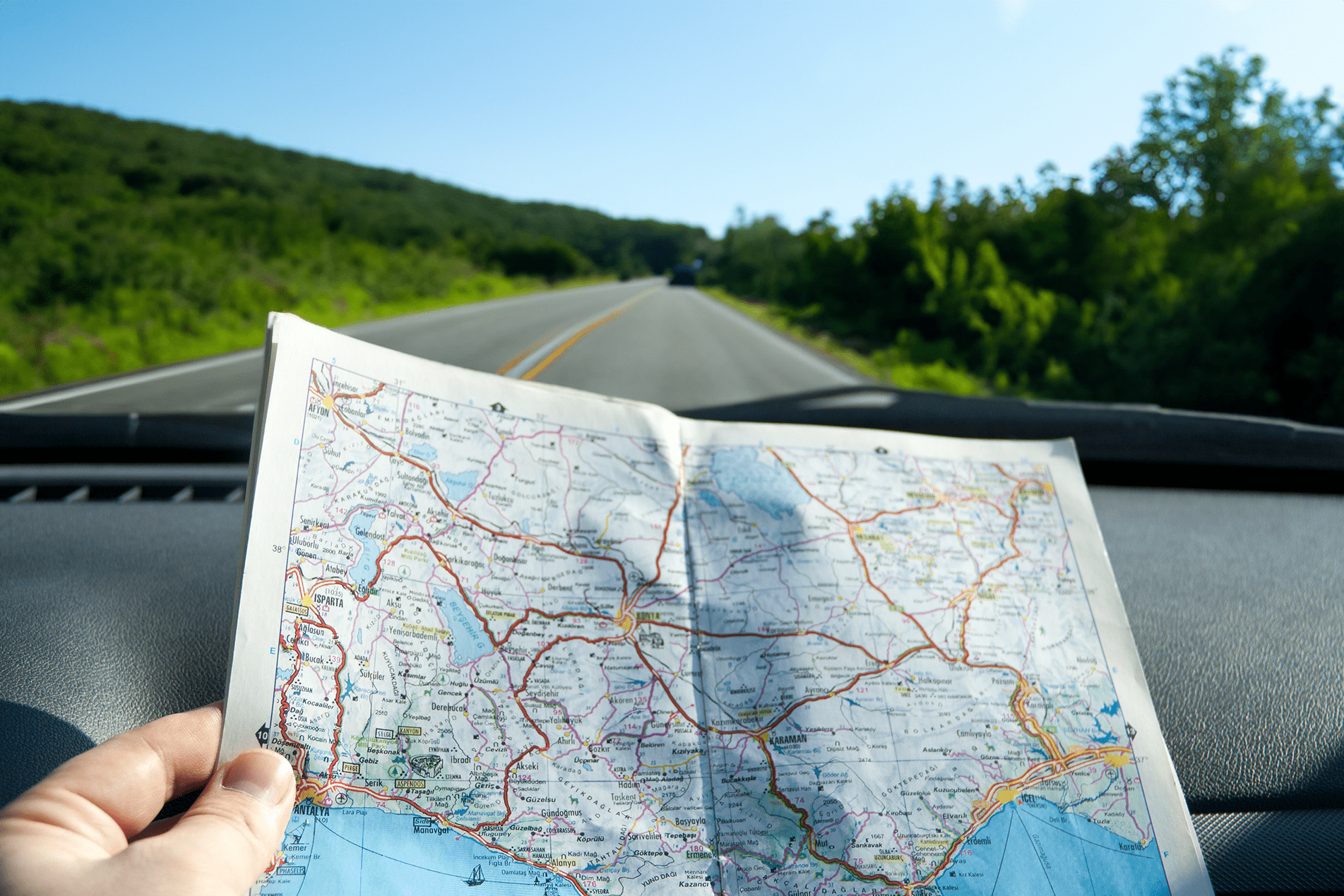 Road map in a car while driving on a country road