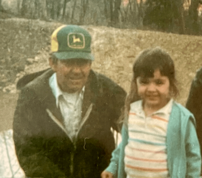 Old photograph of a grandfather and his granddaughter